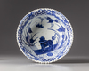 A JAPANESE BLUE AND WHITE BOWL DEPICTING A FU DOG,19TH CENTURY