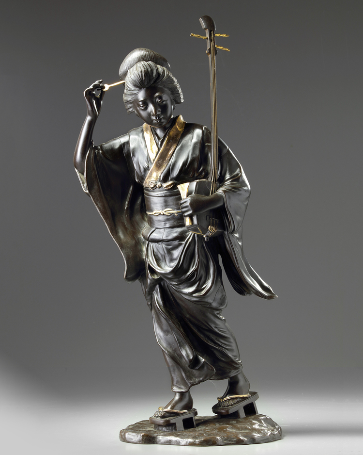 A Japanese gilt bronze lady figure