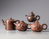 A group of four Chinese Yixing teapots
