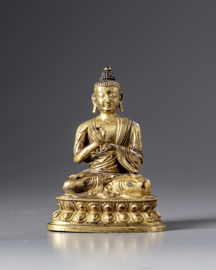A gilt Chinese bronze buddha