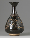 A Chinese black-ground Cizhou-carved bottle vase, yuhuchunping