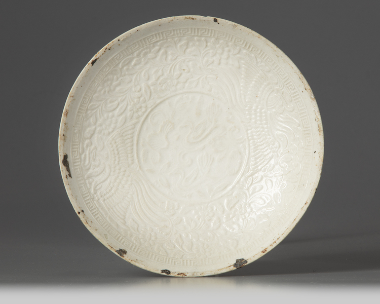 A Chinese white-glazed Dingyao moulded bowl