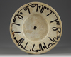 A slip-painted calligraphic pottery dish