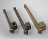 Three Armenian copper pen holders and inkwells