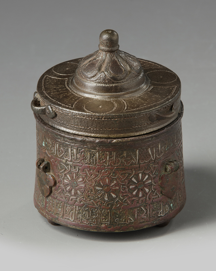 A BRONZE PERSIAN SILVER INLAID INKWELL