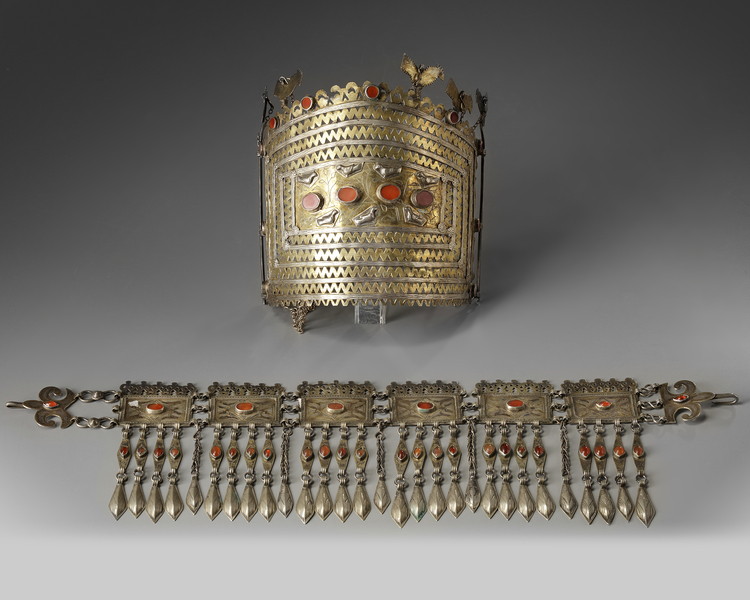 A silver inlaid and gilt tribe headdress and a necklace
