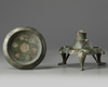An Islamic bronze oil lamp stand