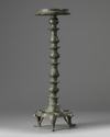 An Islamic bronze oil lamp stand