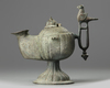 An Islamic bronze oil lamp