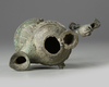 An Islamic bronze oil lamp