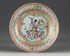 A CHINESE RUBY-BACK FAMILLE ROSE 'LADY AND BOYS' DISH, 19TH - 20TH CENTURY