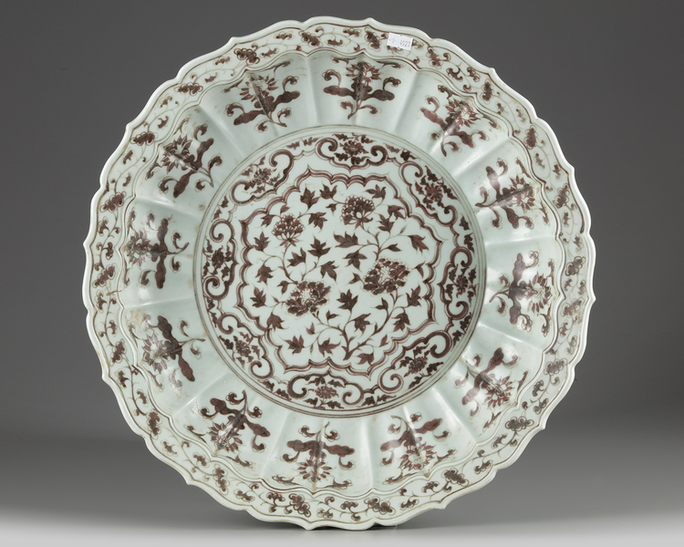 A Chinese Ming-style underglaze copper-red-decorated 'floral' charger