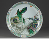A Chinese famille verte 'dragon & warrior' charger