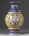 A Chinese famille rose 'Eighteen Luohan' revolving vase