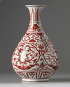 A Chinese iron-red-decorated pear-shaped vase, yuhuchunping