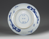A CHINESE BLUE AND WHITE 'ROMANCE OF THE WESTERN CHAMBER' DISH, QING DYNASTY (1644-1911)