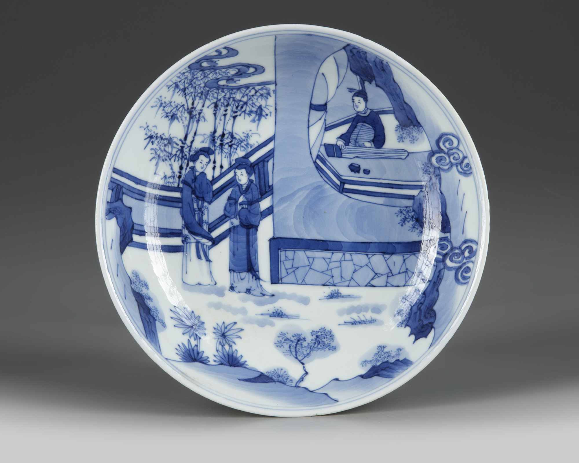 A CHINESE BLUE AND WHITE 'ROMANCE OF THE WESTERN CHAMBER' DISH, QING ...