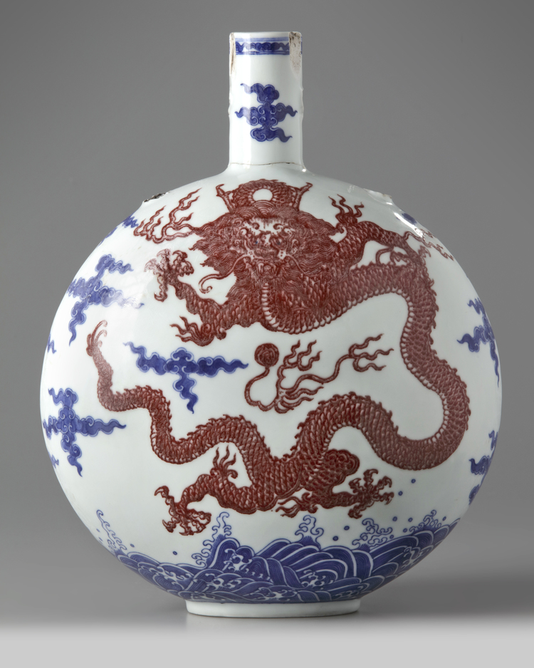 A Chinese underglaze blue and copper-red-decorated 'dragon' moonflask