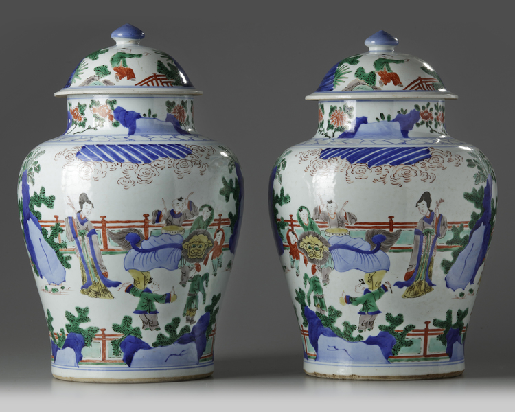 A pair of Chinese wucai vases and covers