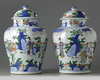 A pair of Chinese wucai vases and covers