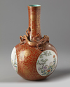 A Chinese coral-ground famille rose 'qilin' vase