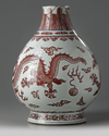 A Chinese underglaze copper-red and blue decorated 'dragon' vase