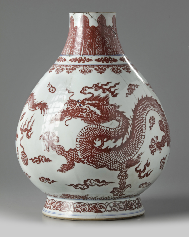 A Chinese underglaze copper-red and blue decorated 'dragon' vase