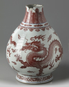 A Chinese underglaze copper-red and blue decorated 'dragon' vase