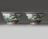A pair of Chinese famille rose jardinieres and stands