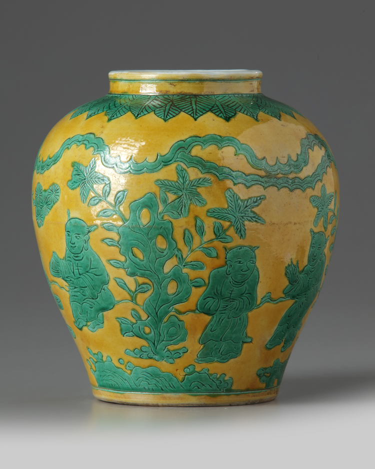 A Chinese yellow ground and green glazed 'boys' jar