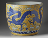 A large Chinese yellow-ground blue and white ‘dragons’ jardinière