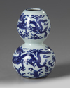 A Chinese blue and white ‘dragons’ double gourd vase