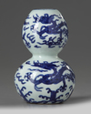 A Chinese blue and white ‘dragons’ double gourd vase
