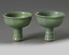 A SIMILAR PAIR OF CHINESE CELADON GLAZED STEMCUPS, LATE YUAN, EARLY MING DYNASTY, 14TH CENTURY