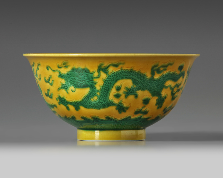 A CHINESE YELLOW-GROUND GREEN-ENAMELLED DRAGON' BOWL, QIANLONG SEAL MARK IN UNDERGLAZE BLUE AND OF THE PERIOD 1736-1795