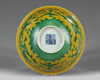 A CHINESE YELLOW-GROUND GREEN-ENAMELLED DRAGON' BOWL, QIANLONG SEAL MARK IN UNDERGLAZE BLUE AND OF THE PERIOD 1736-1795