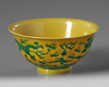 A CHINESE YELLOW-GROUND GREEN-ENAMELLED DRAGON' BOWL, QIANLONG SEAL MARK IN UNDERGLAZE BLUE AND OF THE PERIOD 1736-1795