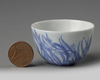 A small Chinese blue and white 'orchid' cup