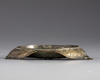 An Islamic bronze lamp stand