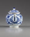 A blue and white teapot and cover