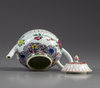 A Chinese famille rose moulded teapot and cover