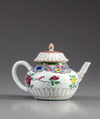 A Chinese famille rose moulded teapot and cover