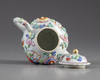 A Chinese famille rose moulded teapot and cover