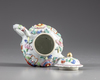 A Chinese famille rose moulded teapot and cover