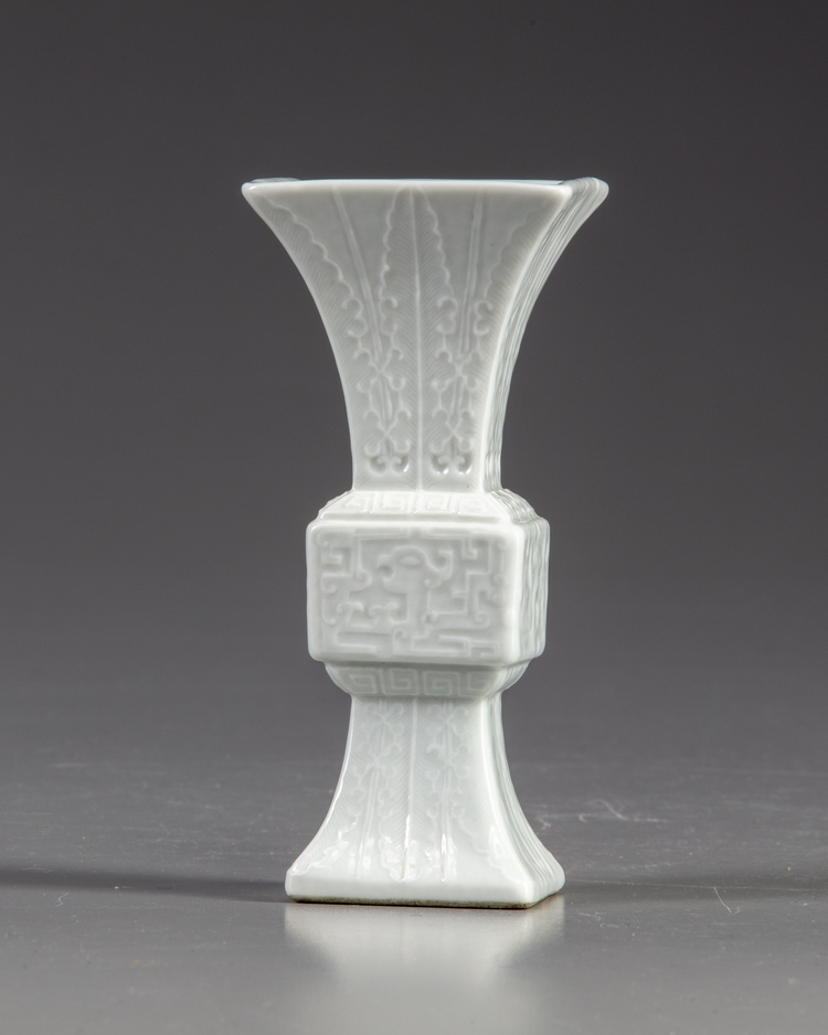 A small Chinese white- glazed gu vase