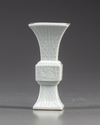 A small Chinese white- glazed gu vase