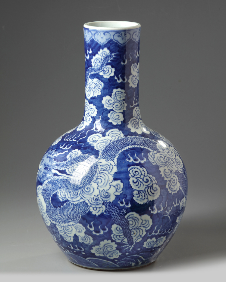 A Chinese dragon blue ground bottle vase