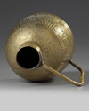 An Islamic brass ewer