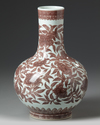 A CHINESE IRON-RED BOTTLE VASE