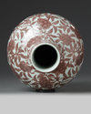 A CHINESE IRON-RED BOTTLE VASE